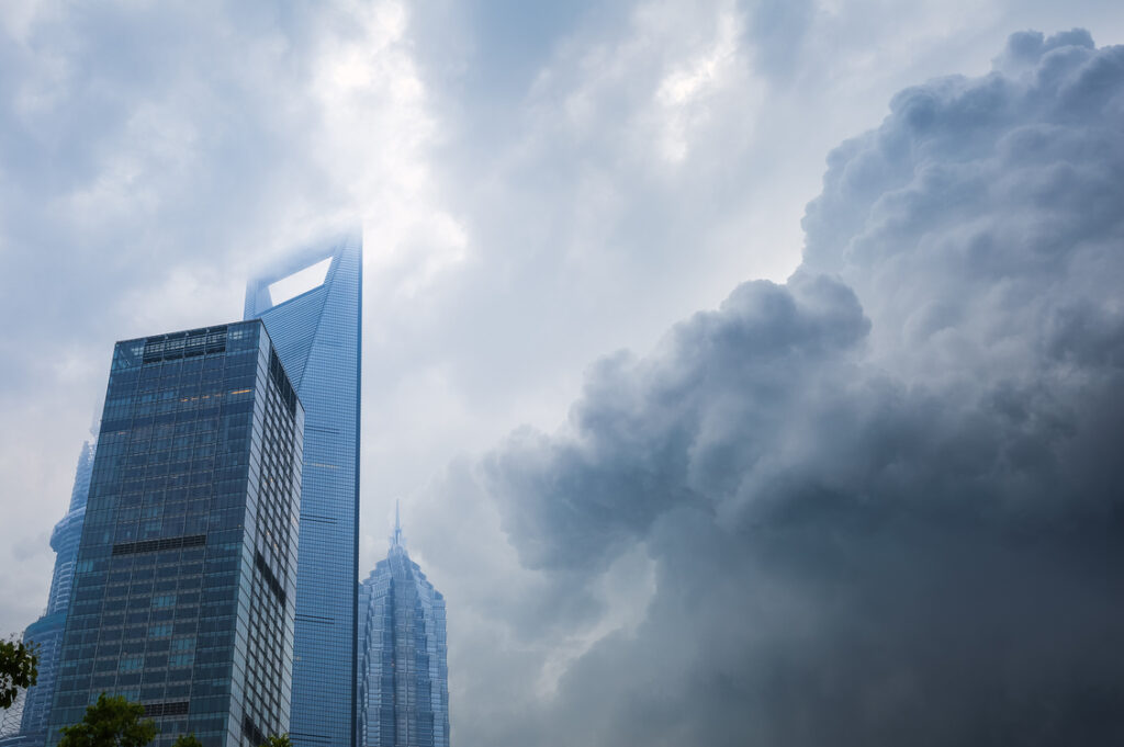 Storm clouds gathering over a city skyline, the kind of moment that tests a tree care company's back office support service
